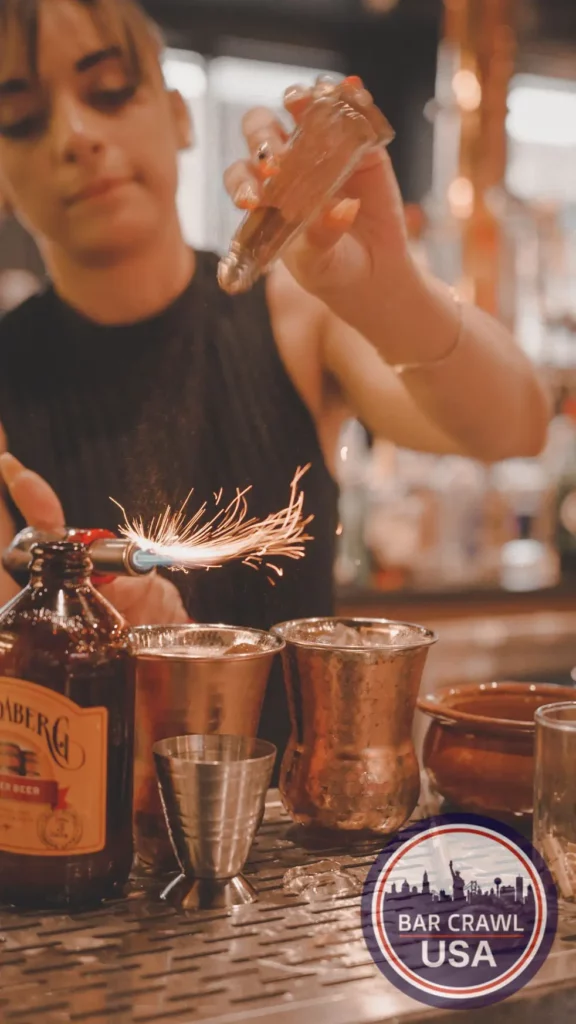 Alpharetta Vertical Fire Shot | Bar Crawl Usa close up image of a bartender lighting a shot on fire